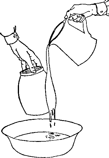 Pouring glaze white holding the pot