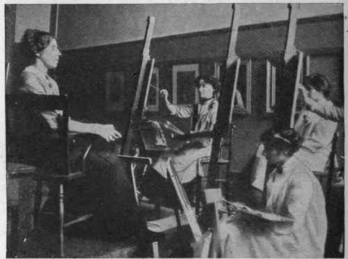 A portrait painting class and their model. Individuality of treatment and breadth of view are distinctive marks of the work of the students at the Slade School