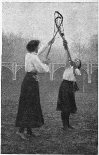 A tussle for the ball in mid air