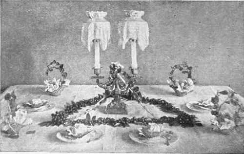Candelabrum triangle of rowan berries and baskets daintily arranged