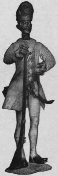 French Toy soldier, early 18th century; dressed in leather, brocade and silver lace. 8 in. high