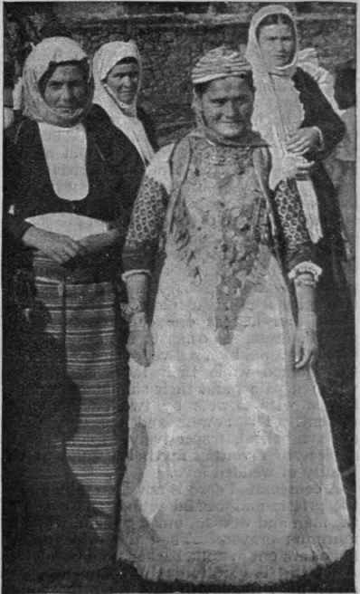 A Greek peasant bride in bridal array, her costume heavily adorned with gold Photo, Underwood