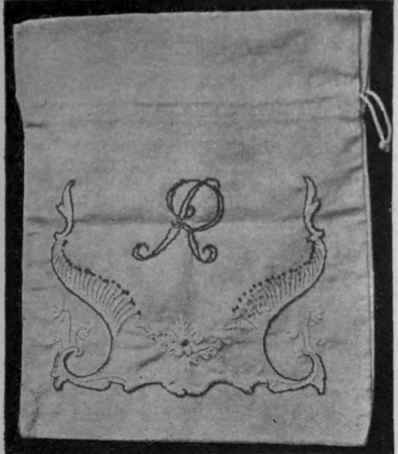 A dainty work bag in embroidered linen, with initial letter that harmonises perfectly with the design worked thereon