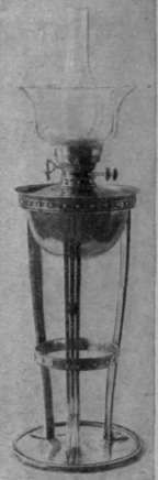 A hand wrought copper lamp of original design, made by the