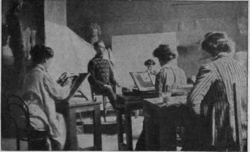 Advanced students of the London County Council Central School of Arts and Crafts painting the miniature portrait of a soldier model