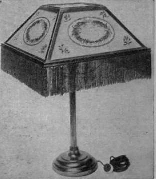 An attractive cloisonne glass lamp shade, edged with a green bead fringe. This design is suitable for a table standard lamp