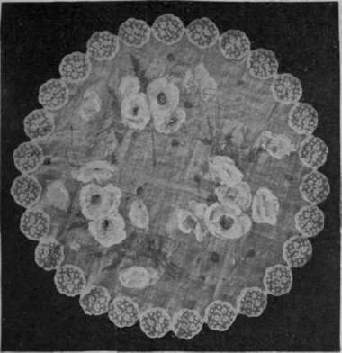 Pale yellow poppies painted on fine muslin, which is edged with Valenciennes insertion.