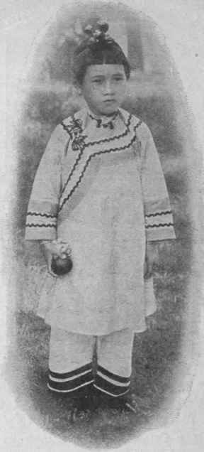 Sa Muai, aged seven, a little Chinese schoolgirl.