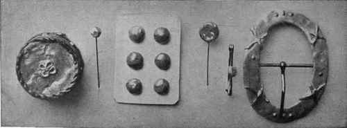 Some charming examples of the possibilities of sealing wax in the form of a box, buttons, lace pins, a brooch, and a buckle