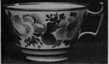 A Nantgarw cup, painted with roses and other flowers, by I homas Pardoe