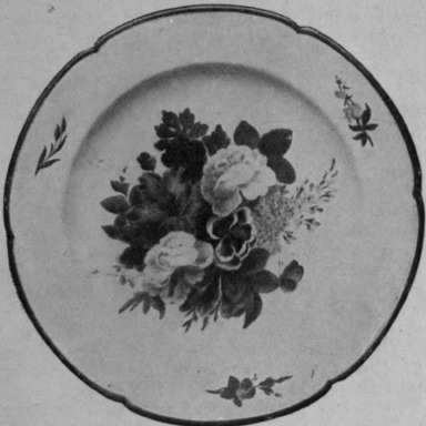 A Nantgarw plate, beautifully painted by William Billingsley, showing his treatment of the rose, the tulip, and the butterfly