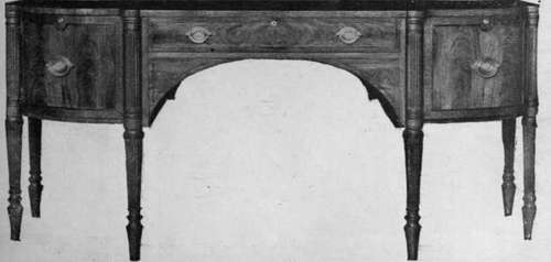 A fine modern reproduction of a Sheraton sideboard. The centre drawer can be used for the table linen and the side cupboards Bartholomew & Fletcher as cellarettes Photo, Booker & Sullivan