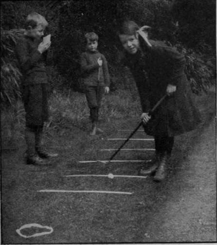 A golf putting course can be arranged on a narrow strip of turf, and affords amusement for the children and good practice for the grown ups 