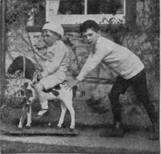 A ride on a toy horse in the open, with the aid of a bigger child, is both an excellent pastime and healthy exercise sleep better out of doors