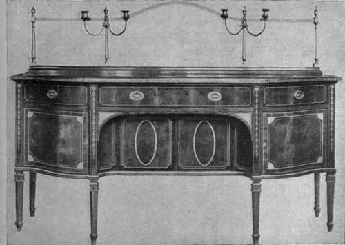 An inlaid mahogany sideboard in the Sheraton style, with cupboards and drawers and a brass railing at the back, on which a curtain Harrods can be hung with good effect Photo, Booker & Sullivan