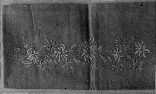Detail of honeysuckle design worked in satin stitch and stem stitch