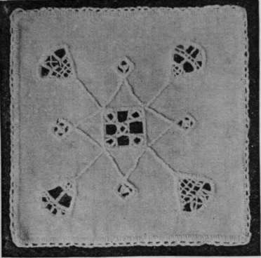 Pincushion cover in cut work embroidery. A square in the centre