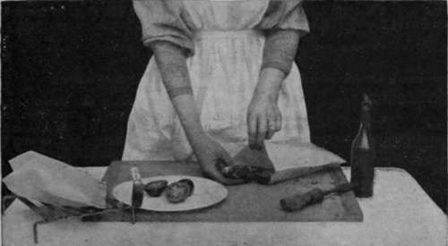 Placing a chop and slices of tomato in the bag