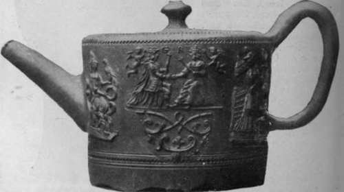 Tea pot, red stoneware (Elers ware); moulded with figures, in low relief, of George 1. and his