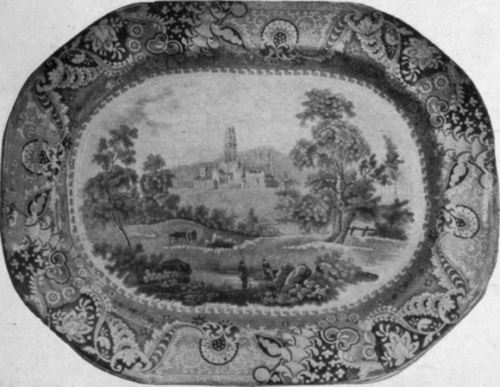 A dish bearing an Irish view in dark blue, with a lace border. Lace borders were often copied from the wallpaper of the period