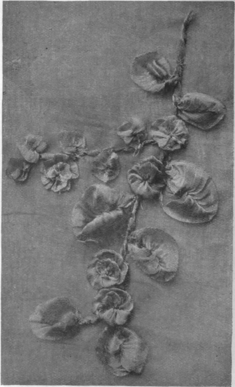 A floral spray in hoarfrost embroidery. Dainty and light, such a spray can be worn in the hair or as a corsage ornament