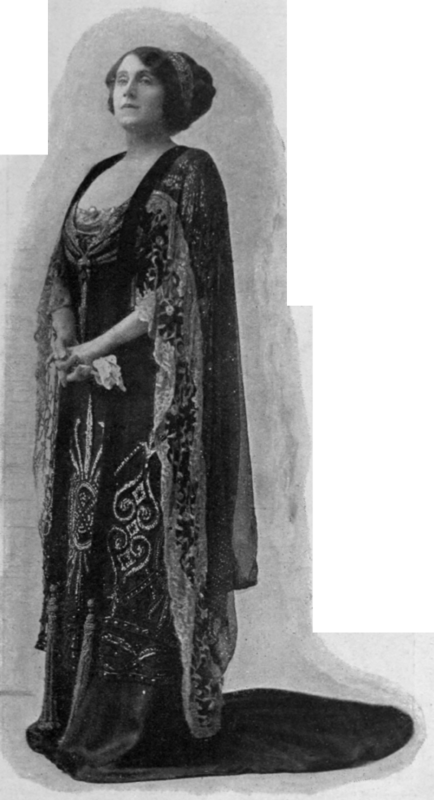 A gorgeous dress of black satin and tulle with silver and jet embroidery, well suited to the stately figure of the wearer, Miss Julia Neilson, in The Popinjay