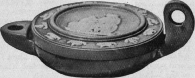 A lamp by W. Adams of antique pattern in cane coloured glazed ware, with cameo figures in white in Wedgwood style