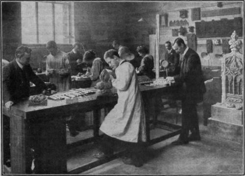 A wood carving class at work. All students taking the diploma course are required to specialise in one craft