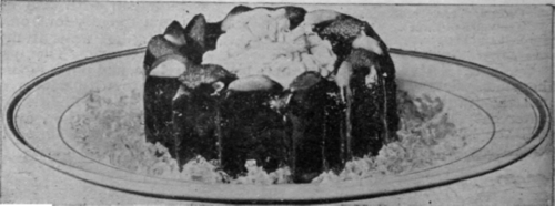 Gateau of Prunes with Cream. Prunes served in this manner are very delicious, and form a sweet that is much liked