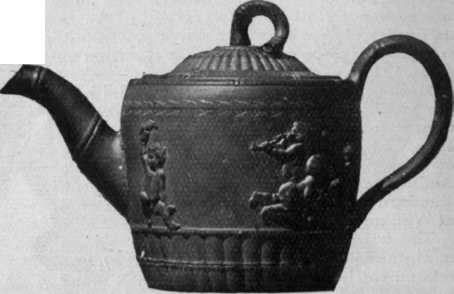 Staffordshire teapot in Wedgwood style in cane coloured ware with blue enamel bands From the South Kensington Museum
