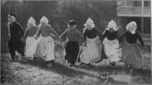 Sunshine and Laughter in the land of tulips. Young Holland at play in the old world province of Volendam