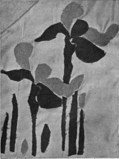 The stately iris is specially adapted for a design in applique velvet for the woman who favours classical and statuesque effects