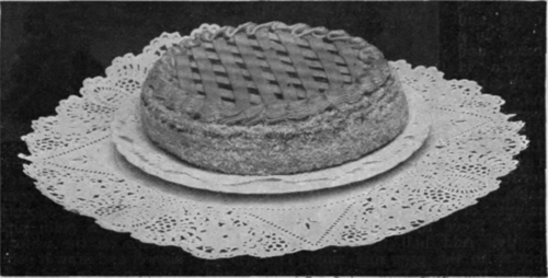 Windsor Cake. Decorated with bands of icing in two colours in a trellis pattern
