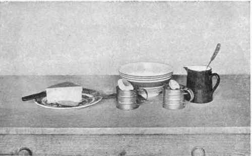 Measuring cups and teaspoons and tablespoons illustrating the measuring of dry ingredients, butter, and liquids.