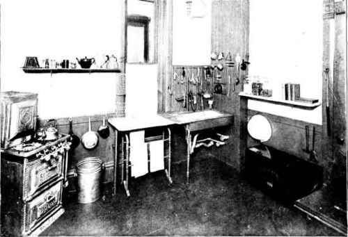 A Dark Old Fashioned Kitchen Made Convenient And Attractive At Small Expense