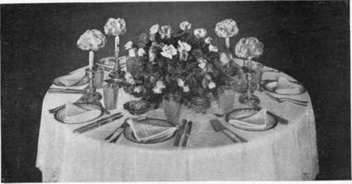 A Bridesmaids Table With Pink Roses