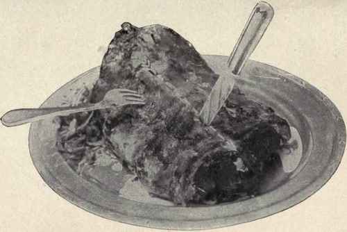Saddle of Mutton. No. 2. (See also p. 222.) Showing the second cut, right down the centre of joint. Having made this cut, the carver proceeds to slice the joint to left or right, taking care that the slices are of moderate thickness   say one quarter of an inch.