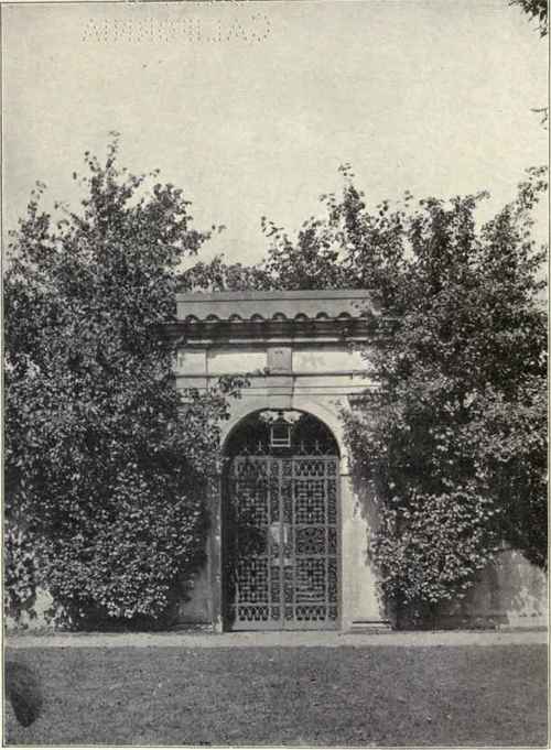 The scarlet thorns planted on both sides of the wall on either side of the gate make an excellent frame for this architectural detail at the garden entrance