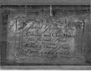 Advertisement on back of foregoing chair.