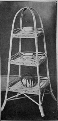 A THREE TIER STAND MADE OF WILLOW