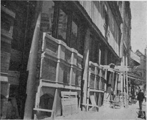Corner store on Nicollet Avenue, Minneapolis. Removing brick work to permit more show windows. A not uncommon reconstruction.