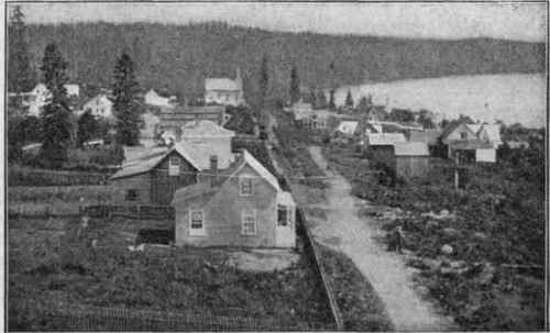 Second Street, Seattle, in 1876, looking south. Lots which sold in 1860 for $10 now bring $120,000. None of the original buildings survive.