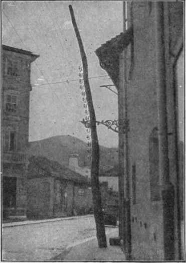 Pole Line Running Through Principal Street in an Italian Town