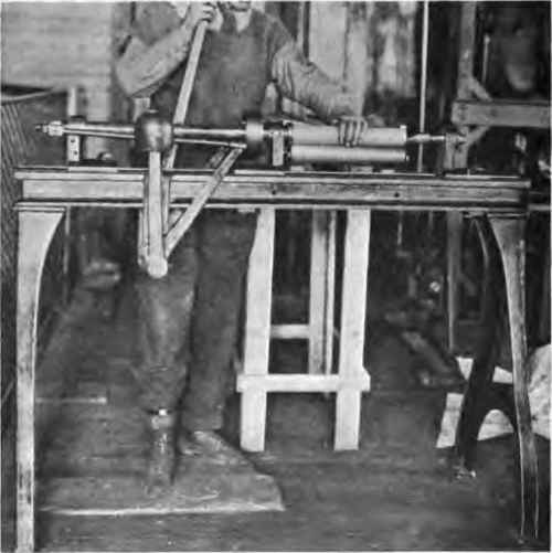 Case rolling machine showing final operation.