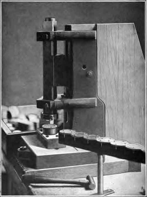 Machine nailing plates to plugs.
