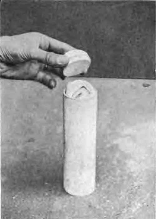 Placing identification plug in position.
